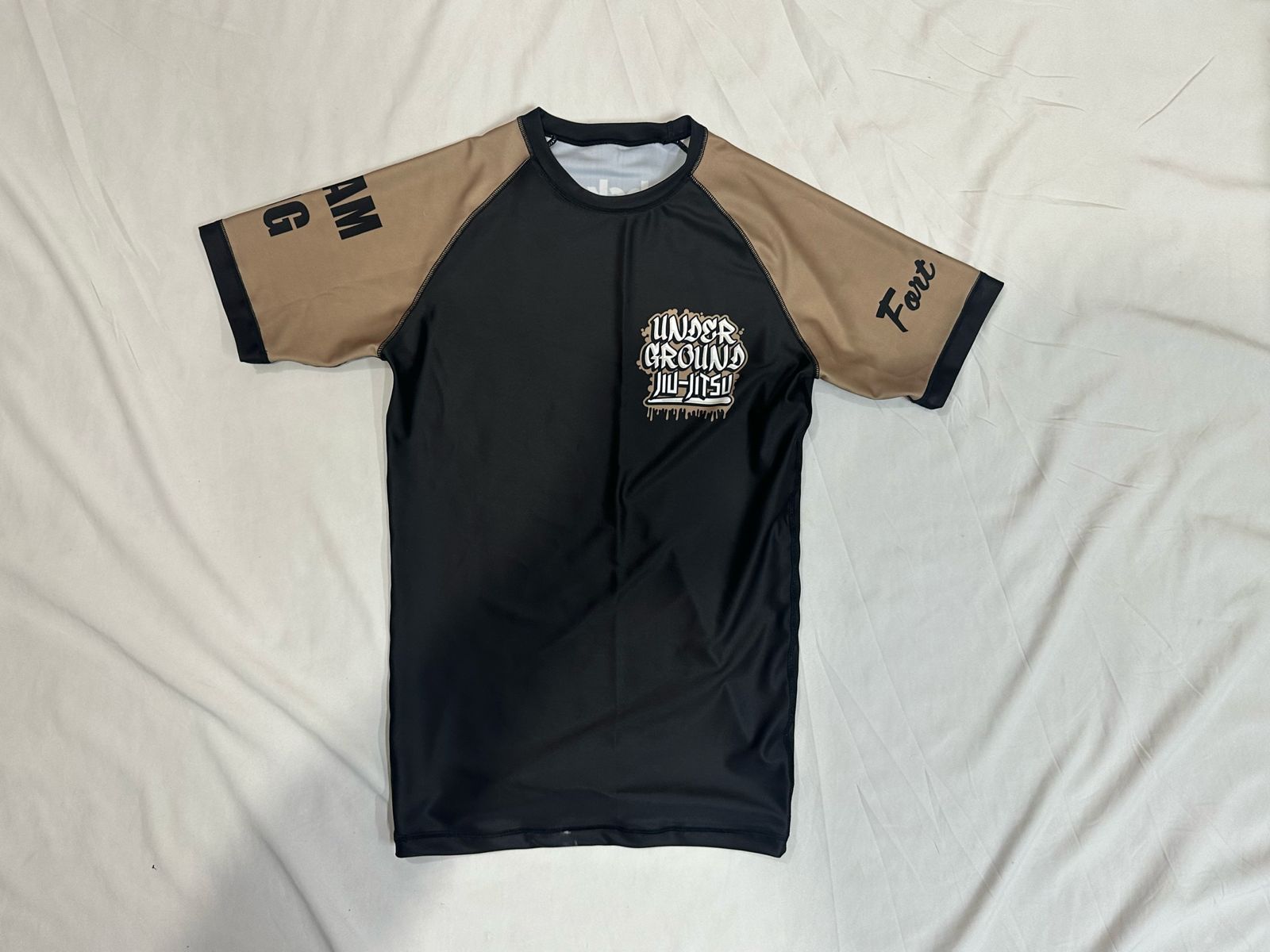 Black and gold Underground short sleeve rash guard