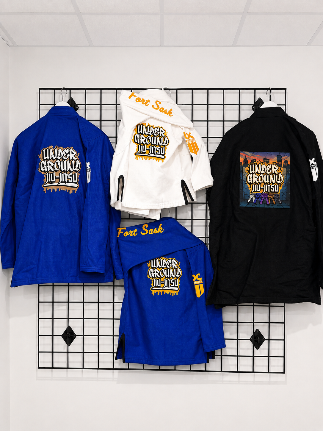 Underground Jiu-Jitsu academy gis in white, blue and black with graffiti back logos