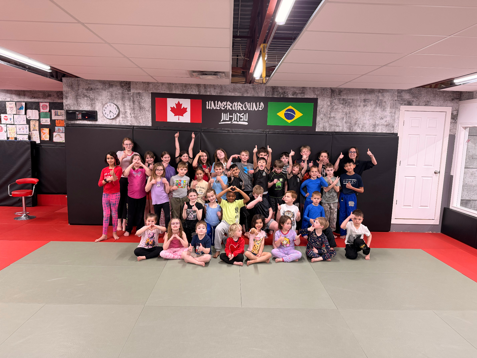 Youth martial arts class practising takedowns and control positions at Underground